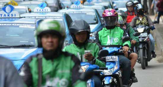 blue bird and gojek as rides in indonesia