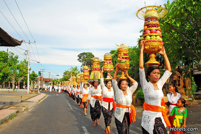 locals in bali walking on the roads